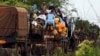 Muslims fleeing sectarian violence are on top of a truck with their belongings -- on the road between Bangui and Sibut -- on a convoy being escorted by French peacekeepers to the south eastern town of Bambari, Central African Republic, April 20, 2014.