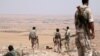 Fighters of the Manbij military council, take an overwatch position in the southern rural area of Manbij, Syria, June 1, 2016. 