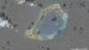 A satellite image shows what the Asia Maritime Transparency Initiative says appear to be anti-aircraft guns and what are likely to be close-in weapons systems (CIWS) on the artificial island Subi Reef in the South China Sea in this image released on Dec. 13, 2016.