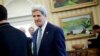 Secretary of State John Kerry is seen in the Oval Office of the White House in Washington, Monday, March 17, 2014, during President Barack Obama's meeting with Palestinian President Mahmoud Abbas.