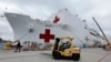 FILE - Supplies are loaded into the San Diego-based hospital ship USNS Mercy as it prepares for possible deployment to aid the typhoon-stricken areas of the Philippines from its port in San Diego, California, Nov. 15, 2013. 