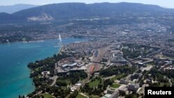 FILE - The buildings of the European headquarters of the United Nations are seen in front of the city of Geneva with Lake Leman and the Jet d'Eau fountain.