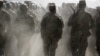 FILE - Afghan National Army (ANA) officers march during a training exercise at the Kabul Military Training Centre in Afghanistan, Oct. 7, 2015. 