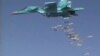 FILE - A still image, taken from video footage and released by Russia's Defence Ministry, Aug. 18, 2016, shows a Russian Sukhoi Su-34 fighter-bomber based at Iran's Hamadan air base, dropping bombs in the Syrian province of Deir Ezzor. 
