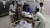 Soldiers help paramedics move the body of one of four Frontier Corps personnel killed by gunmen in Quetta, Pakistan, June 29, 2016.