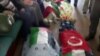 Image made from video provided by TVNET, June 4, 2010, shows bodies shrouded in sheets and flags on board the aid ship Mavi Marmara after a maritime showdown between Israeli commandos and activists on board the ship.