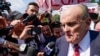 FILE - Rudy Giuliani speaks in Atlanta, Georgia, on Aug. 23, 2023. A federal judge on Aug. 30, 2023, entered a default judgment against Giuliani in a defamation lawsuit brought by two election workers in Georgia.