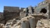 Members of the federal police walk in a destroyed building at Bab al Jadid district in the old city of Mosul, Iraq, June 1, 2017.
