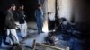 Pakistani tribesmen gather at the site following an attack by Taliban militants in Mohmand district on Feb. 18, 2016. 