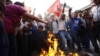 Members of Nepal Student Union affiliated with Nepali Congress chant slogans while they burn an effigy of Prime Minister Baburam Bhattarai in Katmandu, Nepal, May 31, 2012.