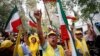 FILE - Mort Zadeh, of Indianapolis, center, shouts during a rally against Iranian President Hassan Rouhani outside United Nations headquarters ahead of the leader's address to the 70th session of the U.N. General Assembly, Monday, Sept. 28, 2015, in New York. 