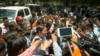 FILE PHOTO - Journalists gathered around Pheng Heng, co-defense attorney for opposition leader Kem Sokha, after a bail hearing session in Phnom Penh, Cambodia, August 22, 2018. (Ty Aulissa/VOA Khmer)