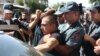 Armenian police detain an unidentified man in Yerevan, Armenia, June 17, 2016. Armed supporters of a jailed opposition leader attacked a police station in Armenia's capital on Sunday.