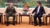 U.S. Chairman of the Joint Chiefs of Staff Gen. Joseph Dunford, left, chats with President Xi Jinping during a meeting at the Great Hall of the People in Beijing, Aug. 17, 2017. 