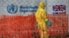 FILE - A person dressed in Ebola protective apparel is seen inside an Ebola care facility at the Bwera general hospital near the border with the Democratic Republic of Congo in Bwera, Uganda, June 14, 2019. 