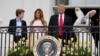 U.S. President Donald Trump stands with his son Barron, first lady Melania Trump and the Easter Bunny at the White House, April 17, 20017.