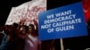 Supporters of Turkish President Recep Tayyip Erdogan hold a placard during a pro-government rally at Kizilay main square, in Ankara, Turkey, July 20, 2016.