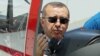 Turkish Prime Minister Recep Tayyip Erdogan in the cockpit of Hurkus (Freebird), Turkey's first locally produced military training plane, outside Ankara, Turkey, June 27, 2012 (AP).