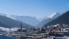 FILE - A Swiss national flag waves in the wind during last year's World Economic Forum, in Davos, Switzerland, Jan. 25, 2019. 