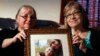 In this June 4, 2014, file photo, mother's Linda Boyle, left and Lyn Coleman hold photo of their married children, Joshua Boyle and Caitlan Coleman, who were kidnapped by the Taliban