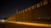 FILE - A portion of the new steel border fence stretches along the U.S.-Mexico border in Sunland Park, New Mexico, March 30, 2017.
