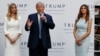 Republican presidential candidate Donald Trump, accompanied by, from left, Ivanka Trump and Melania Trump, speaks during grand opening of Trump International Hotel-Old Post Office, Oct. 26, 2016, in Washington.