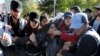 Police detain a protester after an explosion in southeastern Turkish city of Diyarbakir, early Nov. 4, 2016. 