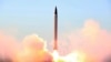 This picture released by the official website of the Iranian Defense Ministry on Sunday, Oct. 11, 2015, claims to show the launching of an Emad long-range ballistic surface-to-surface missile in an undisclosed location. Iran successfully test fired a new 