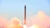 FILE - This picture released by the official website of the Iranian Defense Ministry on Oct. 11, 2015, claims to show the launching of an Emad long-range ballistic surface-to-surface missile in an undisclosed location.